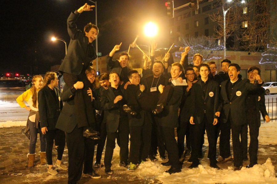 The show choir band celebrates their "Best Band"
 win at the Great River Show Choir Invitational in Davenport. (Lauren Ernst)