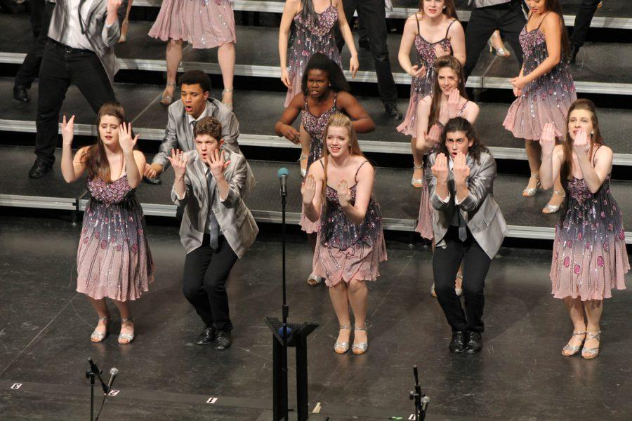 From left to right, back to front: RJ Duncan '18, Shalom Alarape '18, Sasha Tyler '18, Meg Moreland '18, Jackson Elkins '18, Karissa Burkhardt '20, Sam Sunderland '19 and Carrie Harper '19 dance and sing center stage for "A Place Called Home."
(Lauren Ernst)