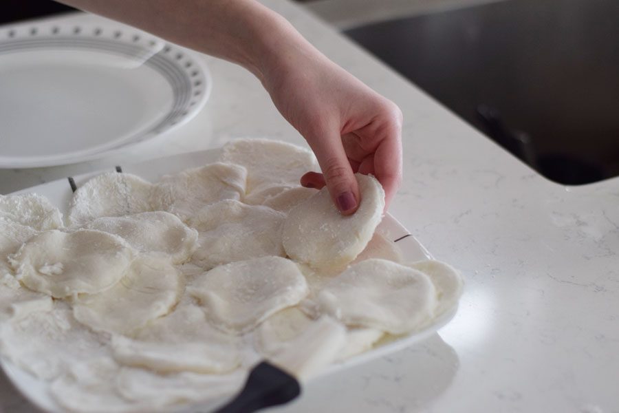 Once rolled, use a glass or a circular cookie cutter to cut small circles from the dough. The circle should be big enough to fit about a tablespoon of ice cream. 