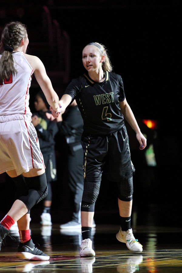 Lauren Zacharias '19 shakes hands with City High's Ashley Joens '18 at the beginning of the game on Fri., March 2.