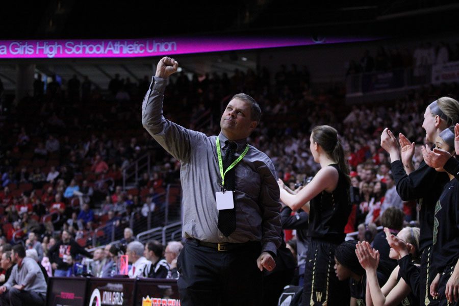 Coach BJ Mayer pumps his fist in the air after the Women of Troy secured the win during the fourth quarter on Fri., March 2.