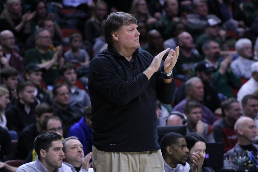 Coach Steve Bergman claps after West secured their win during the second half of the game on Tues., March 6.