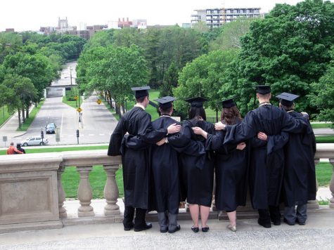 Students celebrate graduation at the Old Capitol in Iowa City.