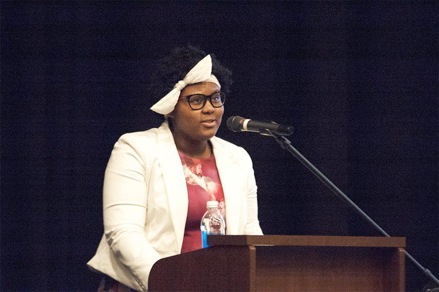 Dasia Taylor '21 introduces Dr. Terrence Roberts on April 6, 2018.
