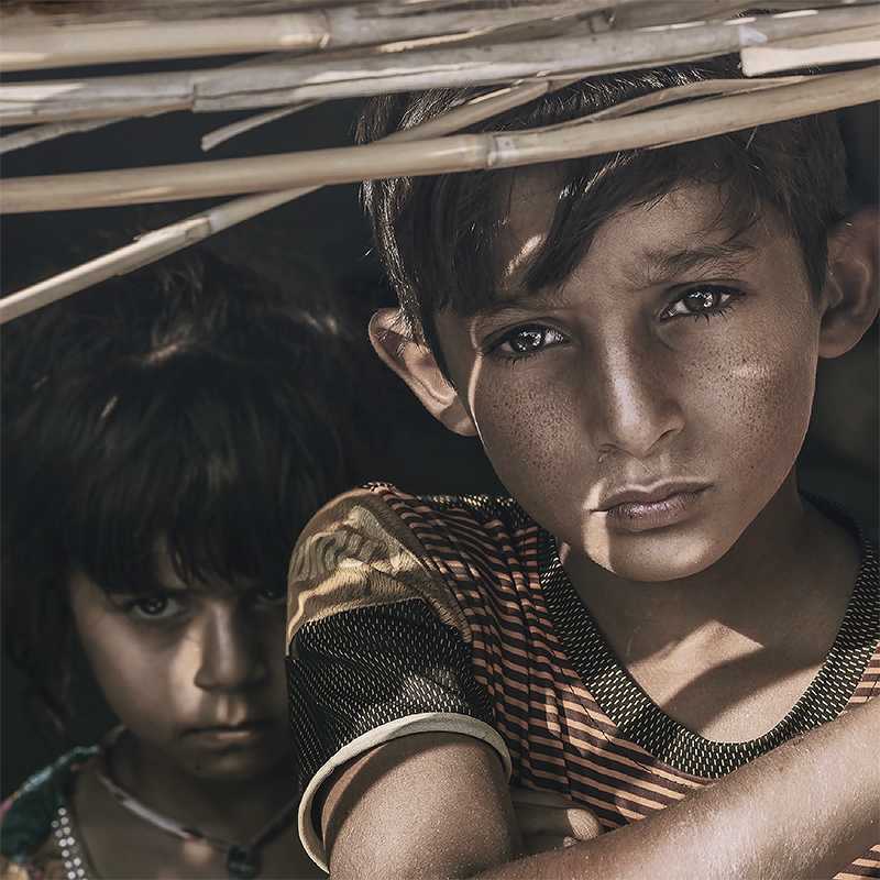 The following day, Al-Ani sees two young boys in the refugee camp and asks them the same question.He discovers they are not siblings, but rather just two kids sticking together. While  Al-Ani was given permission to take their photo, he does not always ask before the shot. 