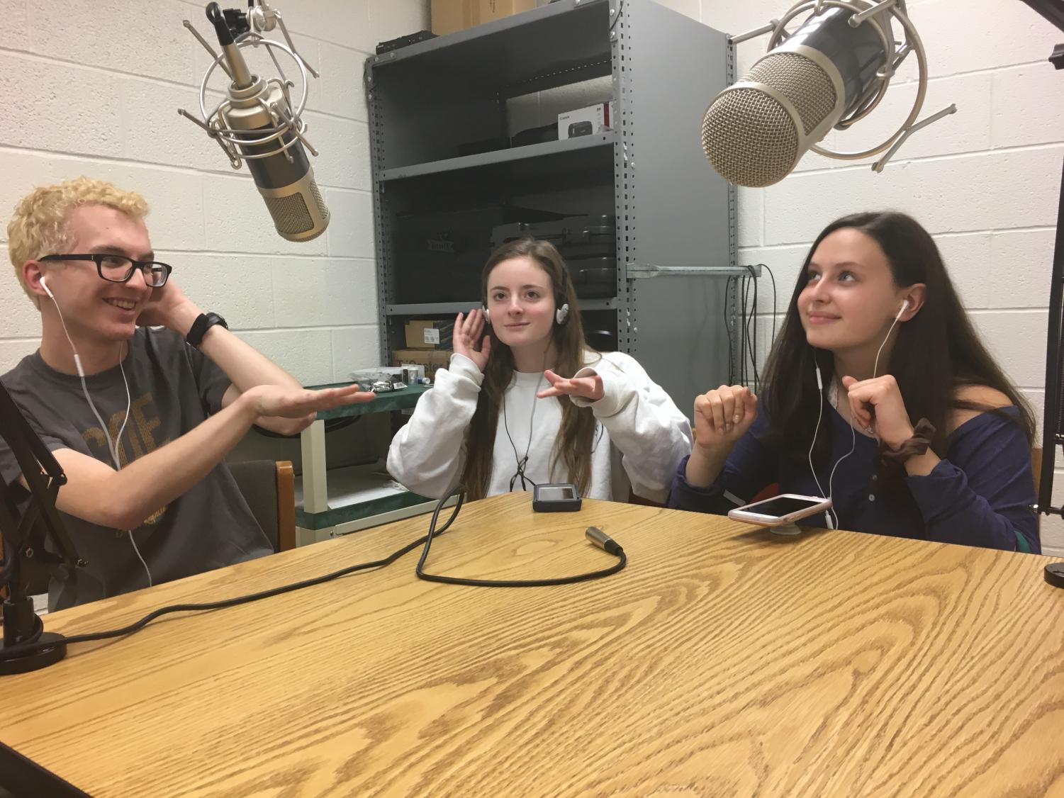 Luke Reynolds '18, Jessica Doyle '19 and Natalie Dunlap '20 listen to music in the podcast lab. In this episode, the trio attempt to guess popular songs.