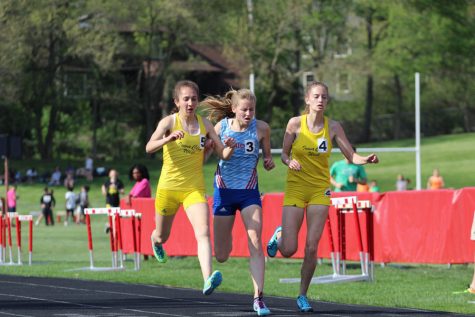Deniz Ince 19, Claire Edmondson 20 from Dubuque Senior and Bailey Nock 18 battle for first place during the girls 3,000 meter run on Thursday, May 10. Ince placed first with a time of 10:39.49 followed by Edmondson with a time of 10:39.52 and Nock with a time of 10:39.55.