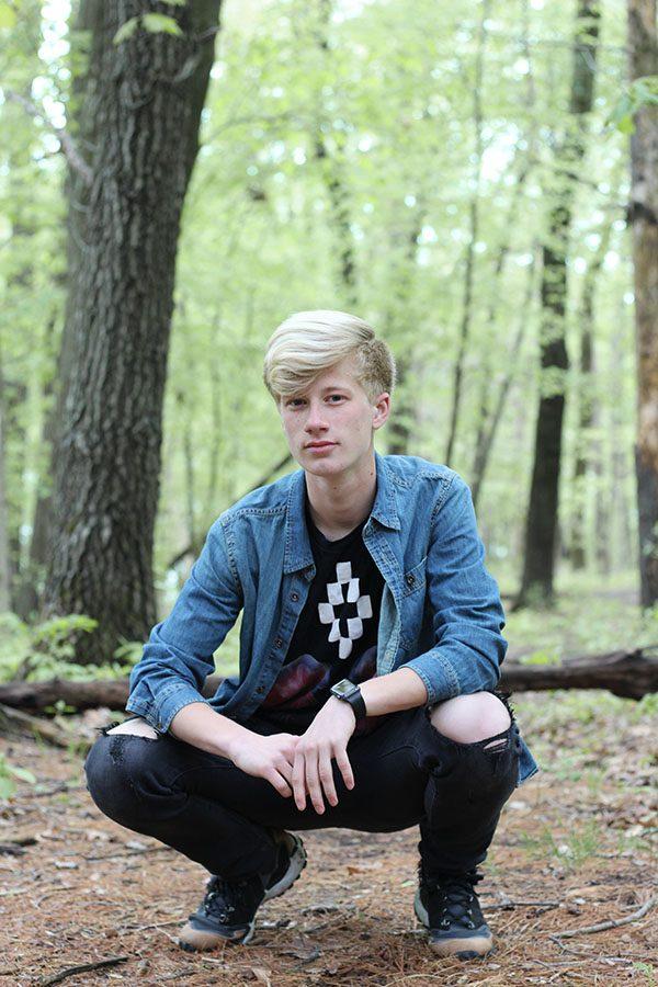 Ethan Goers ‘18 models streetwear on a trail at Lake McBride on Saturday, May 12. When asked how he would describe his style, Goers said, "I have ... quite a few mixes of styles. I sometimes wear some more modern and ... dressy [clothes] and other times I wear more like grunge street style [clothing]—I like to mix it up and keep it interesting."