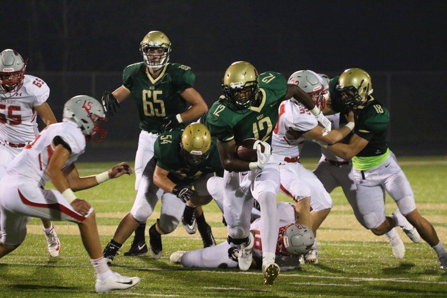 X Lubuelo '19 carries the ball during the first half of the game on Friday, Aug. 24.