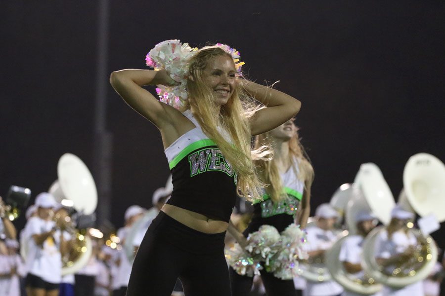 Lauren Doyle '21 performs during the POMs routine during halftime on Friday, Aug. 24.