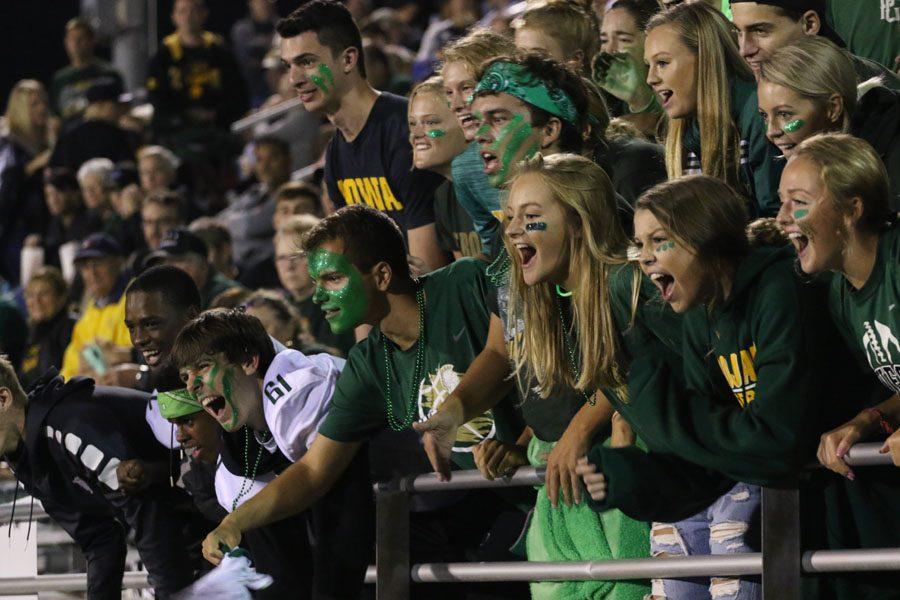 The student sections cheer for the drum line during halftime on Friday, Aug. 24.