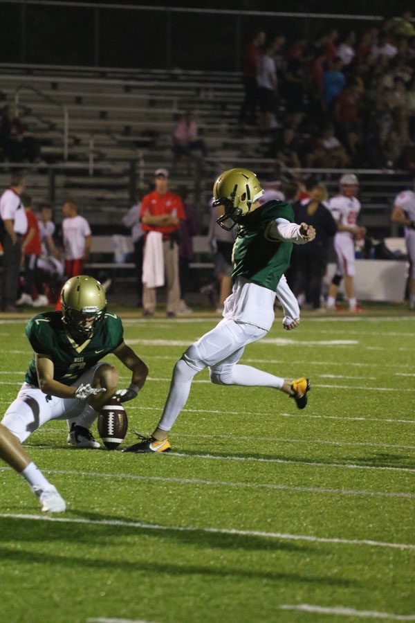 Josh Jasek '19 kicks a field goal after quarterback Joey Kuehn '19 scored a touchdown on Friday, Aug. 24.