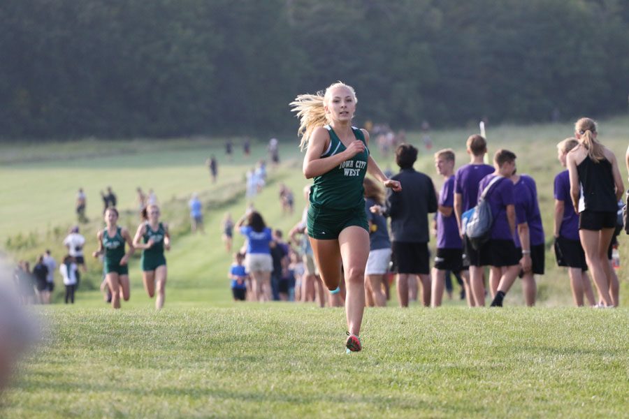 Katie Hoefer '21 runs to the finish line on Thursday, Aug. 23. She placed 7th with a time of 20:24.