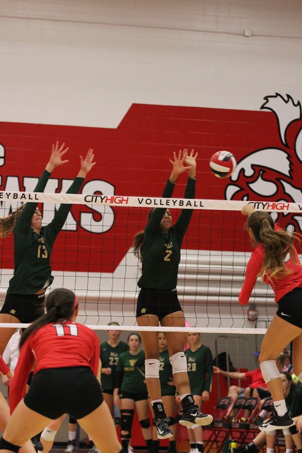 Cailyn Morgan '19 blocks the ball from entering West's side on Tuesday, Aug. 21.