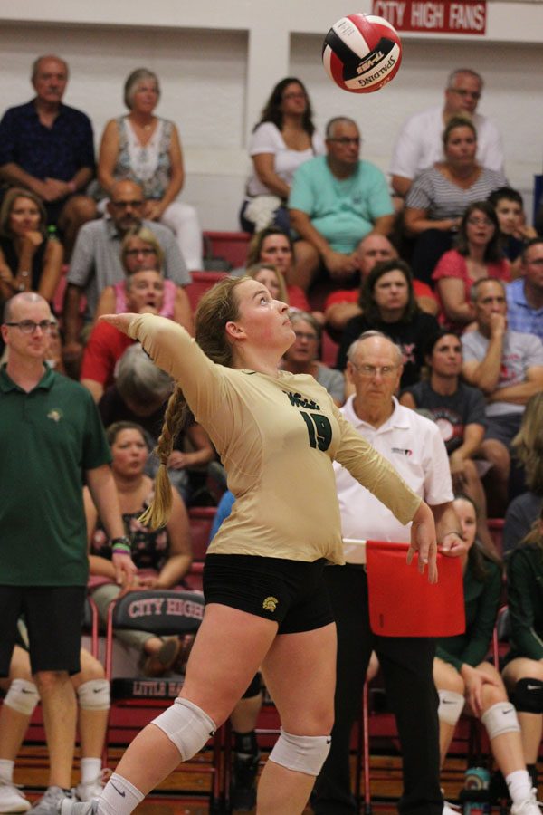 Grace Fleckenstein '19 focuses on serving the ball to City on Tuesday, Aug. 21.