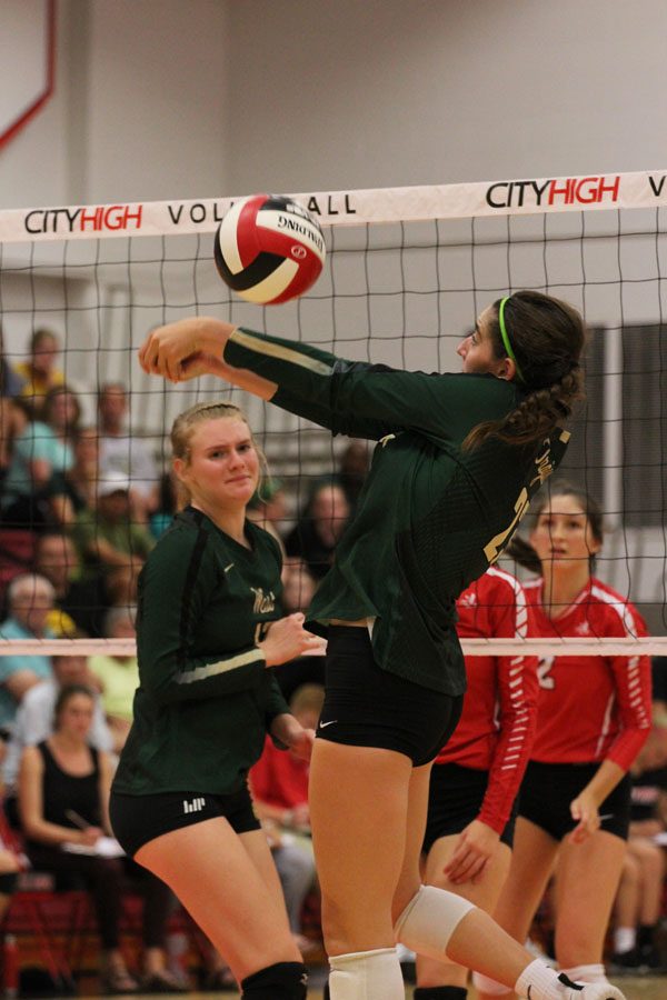 Ellie Kouba '19 bumps the ball over the net during the fourth set on Tuesday, Aug. 21.