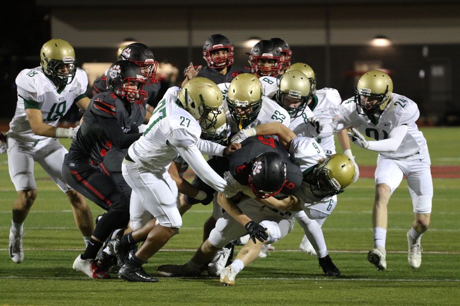 West players tackle Linn-Mars Trey Martin 20 as he brings the ball to their end zone on Friday, Sept. 28.