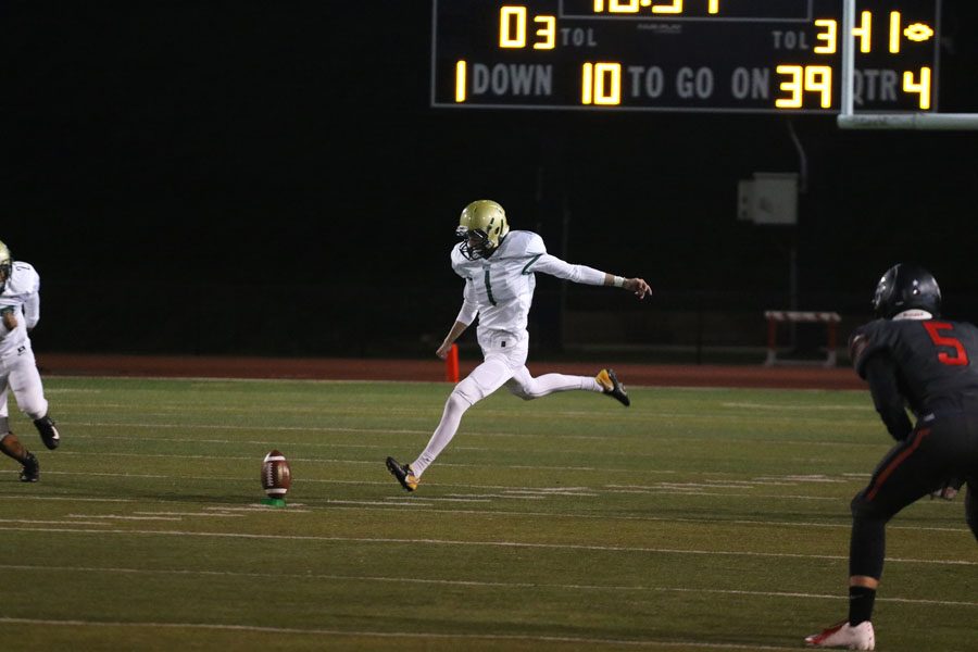 Josh Jasek '19 kicks the ball to Linn-Mar during the fourth quarter after Justin Thomas '19 scored a touchdown on Friday, Sept. 28.