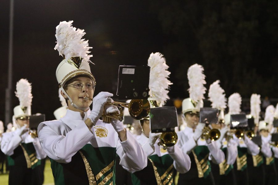 James Mons '19 plays the trumpet during the halftime show on Friday, Sept. 7.