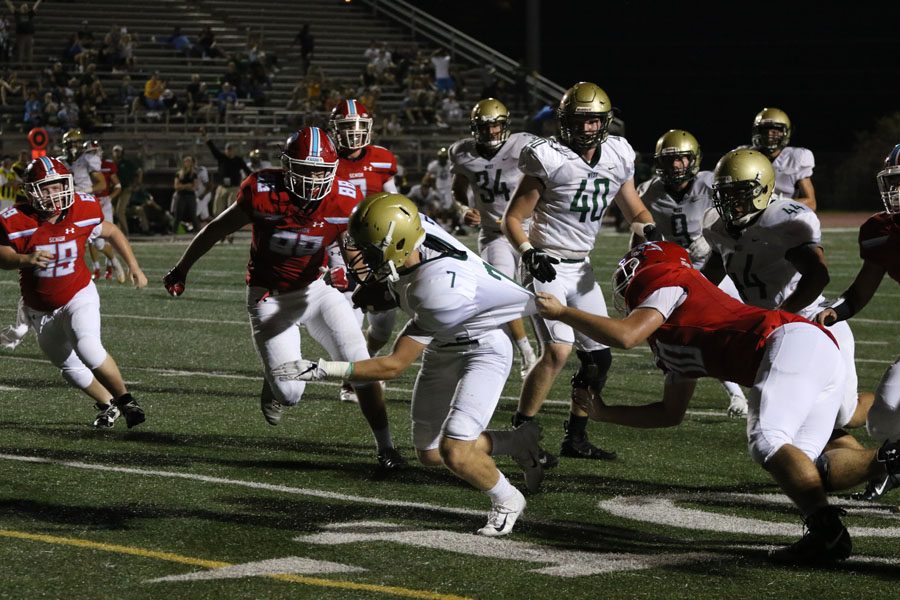 Grant Henderson '20 runs the ball into the end zone after he recovered a fumble during the second half on Friday, Sept. 14. 