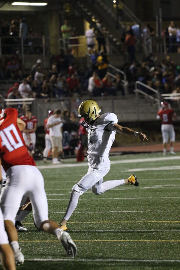 Josh Jasek '19 kicks the ball into the field goal after Owen McAreavy '19 scored a touchdown making it 41-7 West during the third quarter on Friday, Sept. 14.