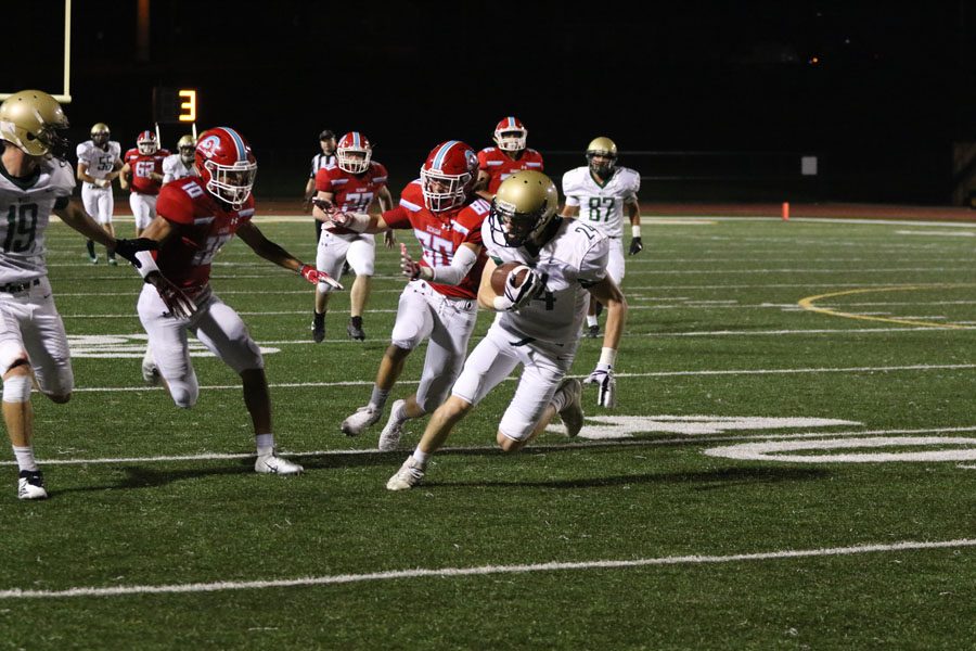 Ryan Gudenkauf '19 runs the ball in for a touchdown during the fourth quarter on Friday, Sept. 14.