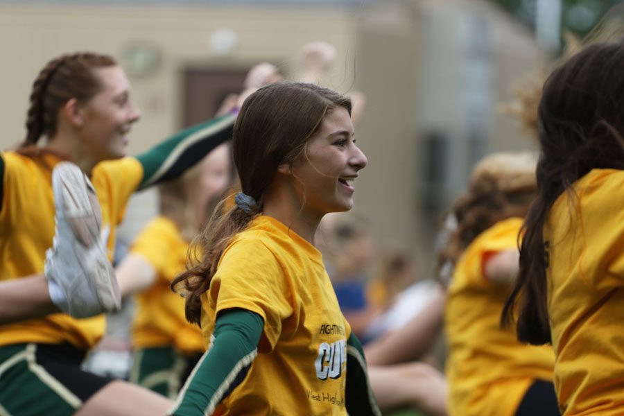 Marissa Goodale '22 cheers at the beginning of the assembly on Friday, Sept. 21.