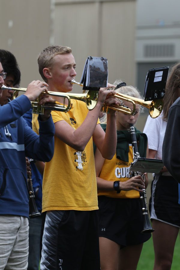 Jaymeson Harms '21 plays the trumpet during the assembly on Friday, Sept. 21. 