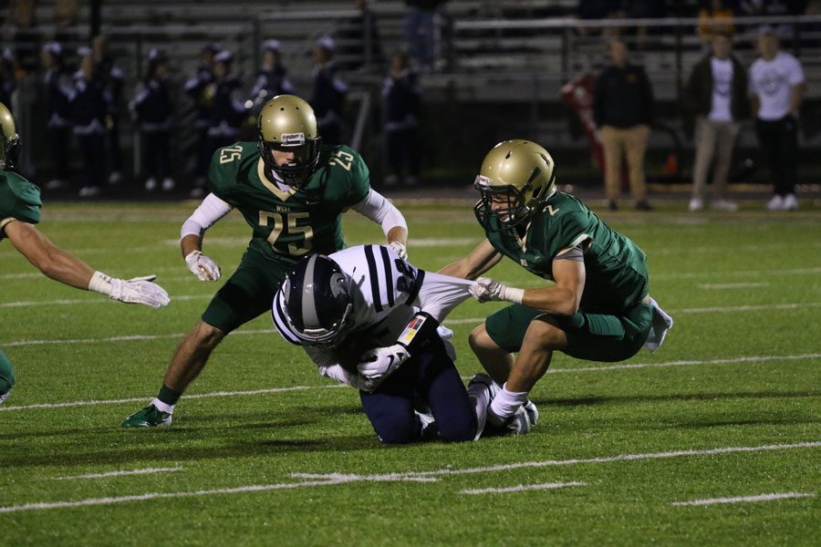 Noah Aanestad '19 takes down Pleasant Valley's Brennan Sarver '19 during the first half on Friday, Sept. 21.