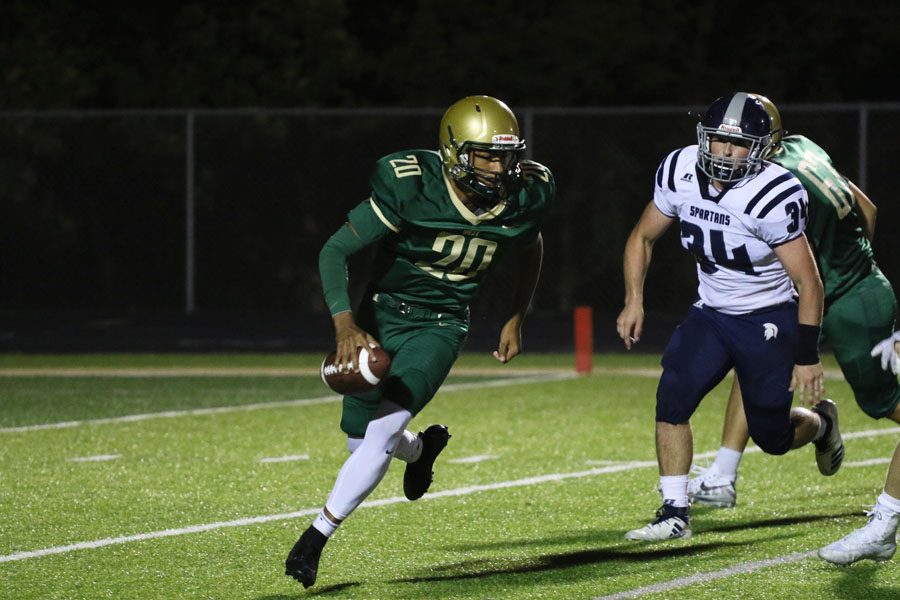 Marcus Morgan '21 runs as he looks to pass the ball during the second half on Friday, Sept. 21.