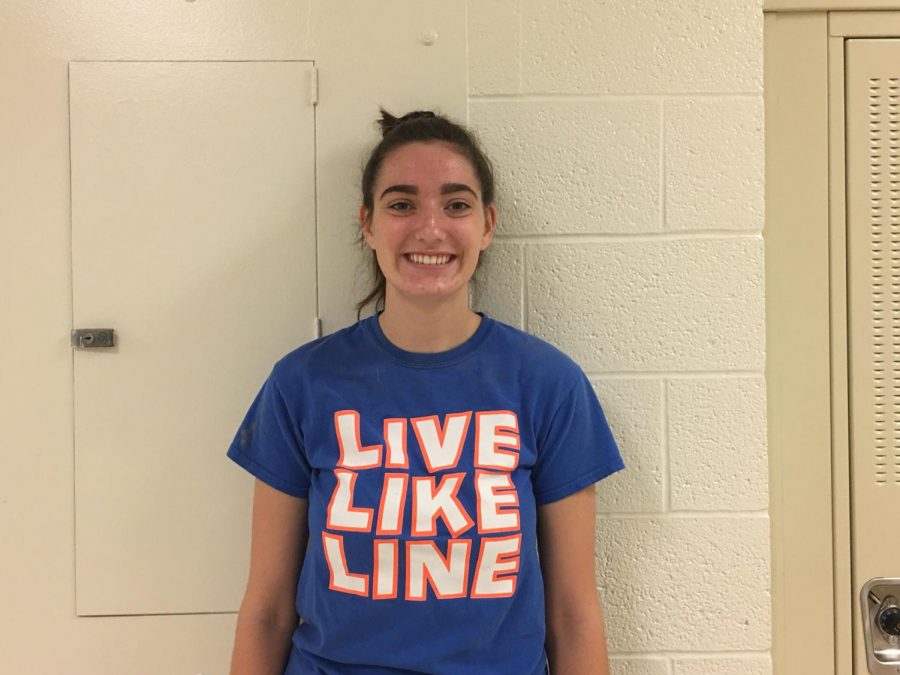 Ellie Kouba 19 stands against a hallway wall on Monday, Sept. 24.