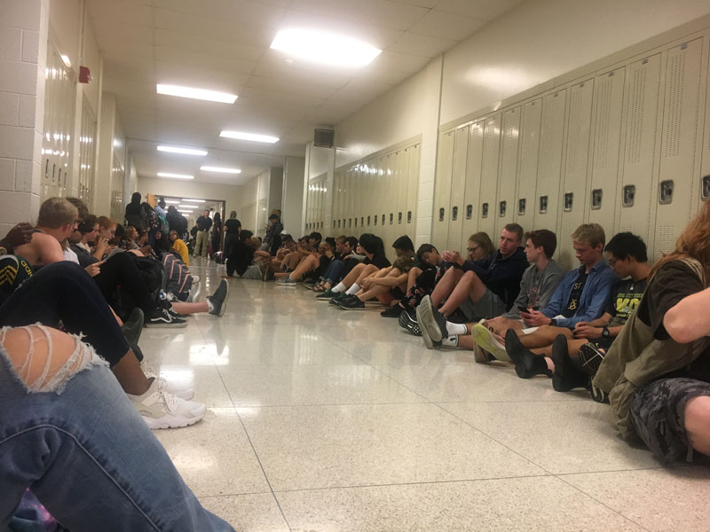 Students sit in the hallways during the tornado warning on Tuesday, Sept. 25. 