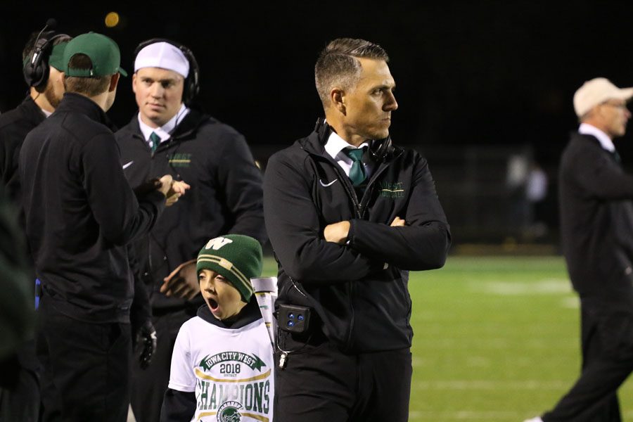 Head coach Garrett Hartwig watches the game progress during the second half on Friday, Oct. 19.