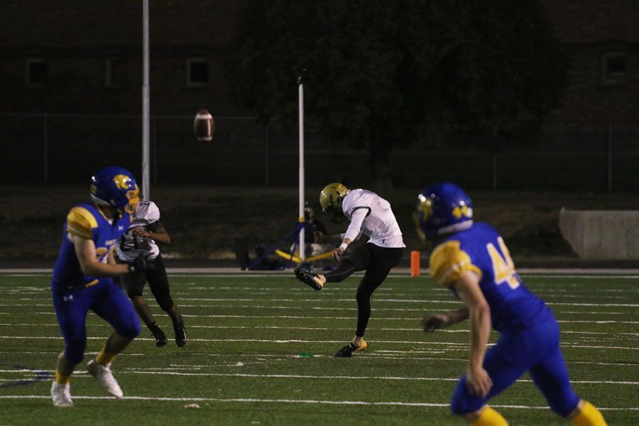 Josh Jasek '19 kicks the ball to Davenport North during the first half on Thursday, Oct. 4.