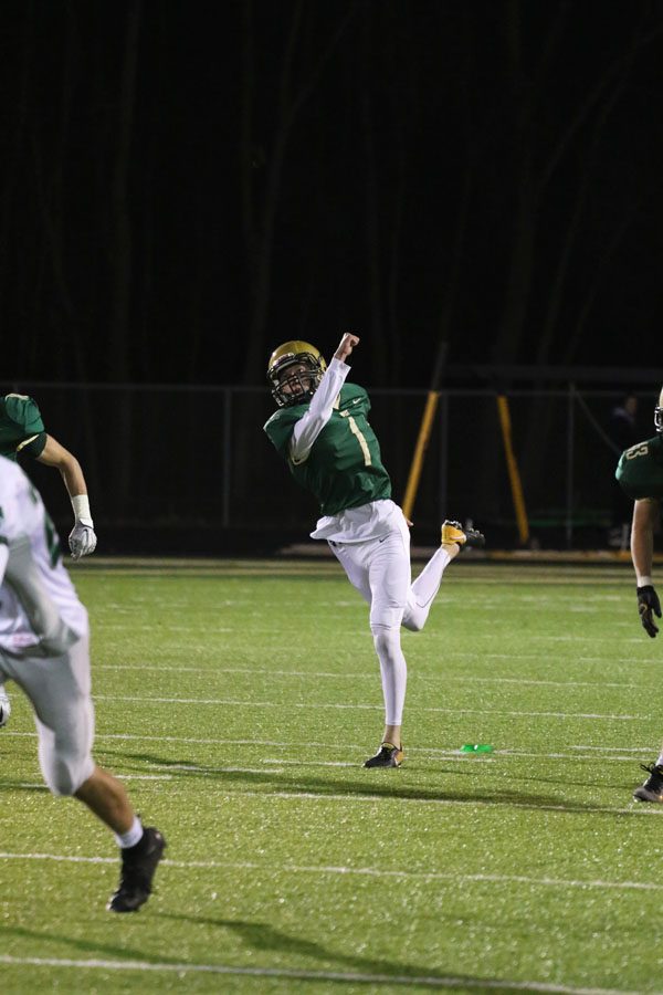 Josh Jasek '19 kicks the ball to Cedar Rapids Kennedy after West scored on Friday, Oct. 26.