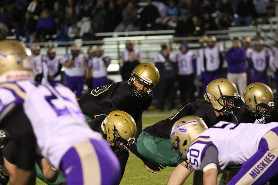 Marcus Morgan '21 calls what play to run during the first half on Friday, Oct. 12.