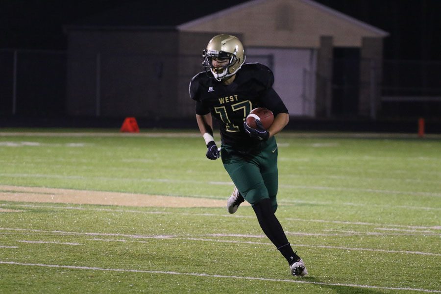 Jalen Gaudet '19 carries a punt return to the end zone on during the first half of the game on Friday, Oct. 12.