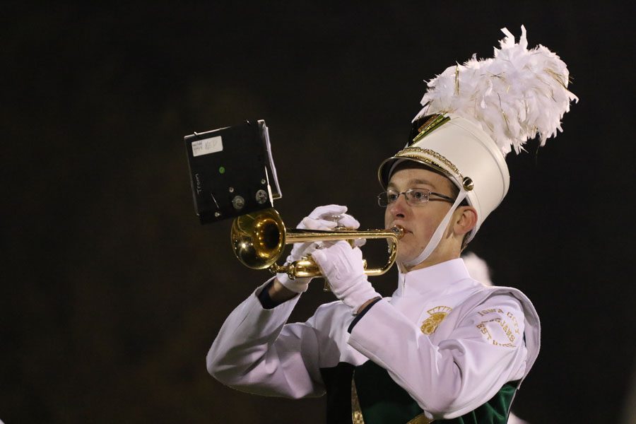 James Mons '19 plays a solo during the marching band's halftime performance on Friday, Oct. 12.