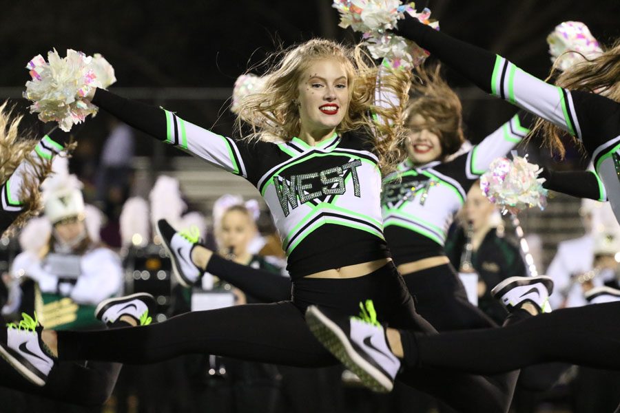 Chloe Gretter '20 dances during the poms halftime performance on Friday, Oct. 12.