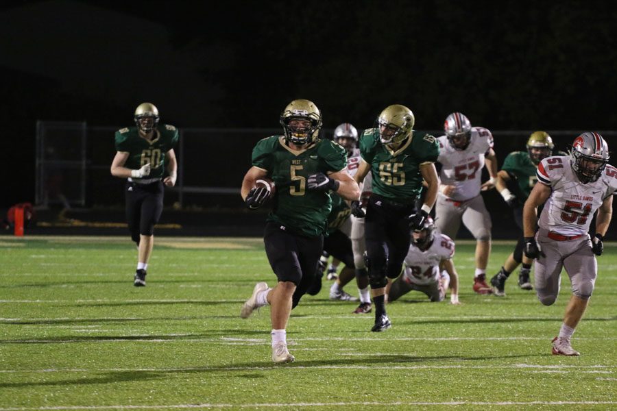 Jason Strunk '19 sprints down the field towards the end zone to score a touchdown during the first quarter on Friday, Oct. 19.