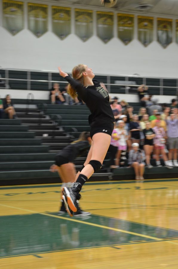 Emily Cray '19 takes her third jump serve in a row, later getting her third ace making the score 20-20 in the second set on Tuesday, Oct. 9.