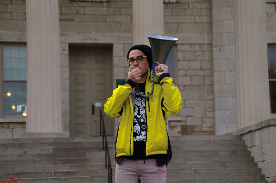 Ryan Hall addresses the crowd at a “Support Trans Lives” rally at the Pentacrest on Oct. 25.