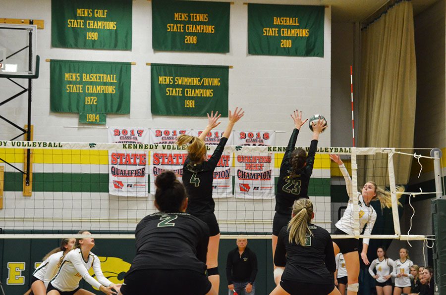 Ellie Kouba '19 and Natalie Young '20 block the ball from a Kennedy hitter on Wednesday, Oct. 17.
