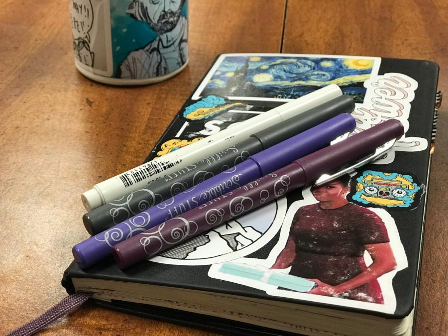 Natalie Dunlaps bullet journal and the pens she uses for it.