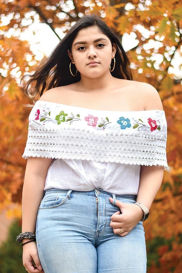 Miriam Aguirre 21 dons the top of a traditional Mexican folklorico dress. Tops like these are typically paired with a long frilly skirt for a full celebration ensemble.