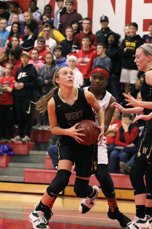 Audrey Koch '21 drives to the basket for a layup during the first half on Friday, Dec. 7.