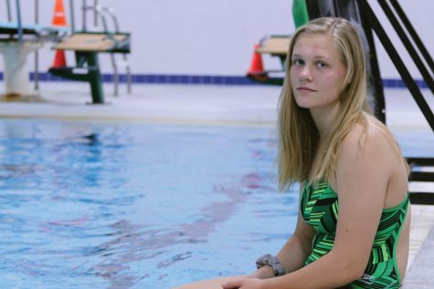 Lily Ernst 20 sits on the edge of the pool for a photo on Monday, Sept. 10.