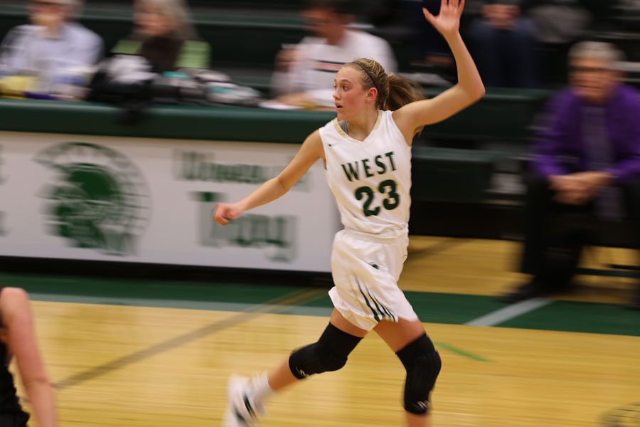 Audrey Koch '21 calls for a pass as she runs down the court. Koch led the Women of Troy with 23 points on Friday, Nov. 30.