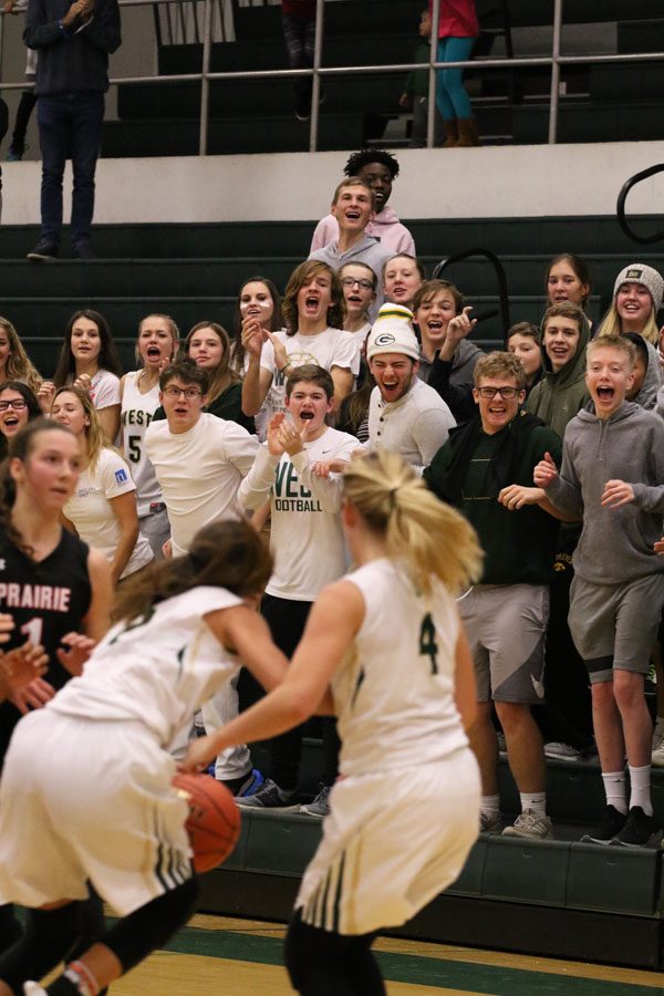 The student section erupts in cheers after Lauren Zacharias '19 scores the game winning buzzer-beater shot on Friday, Nov. 30. 