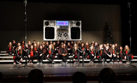 Wests varsity show choir, Good Time Company, sits on the risers during their jukebox-themed show.